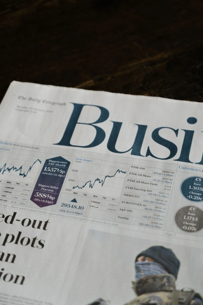 Business newspaper with financial charts – strategic tax planning for small businesses, eCommerce sellers, and service companies.